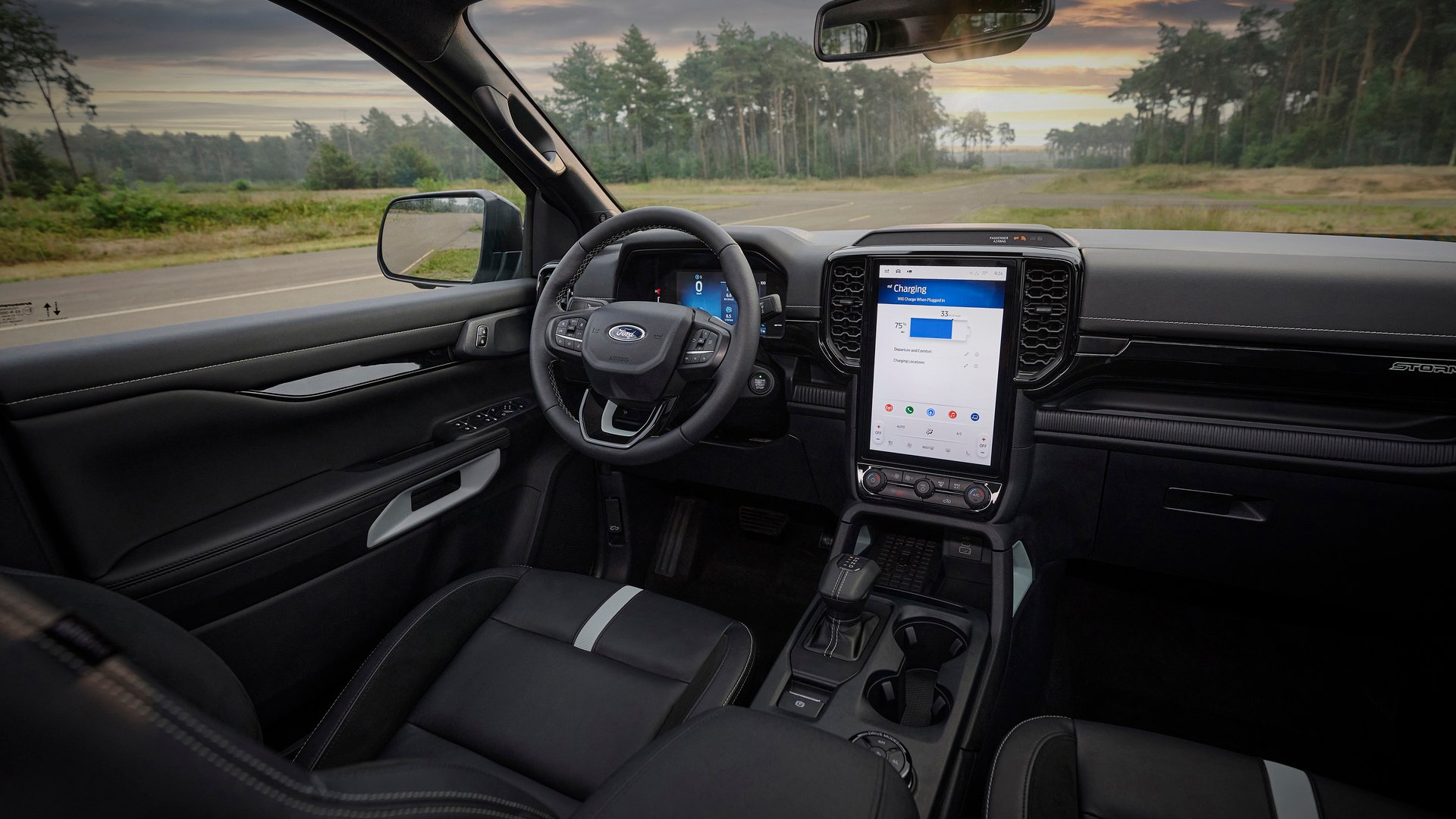 Interior view of the Ford Ranger PHEV's cabin, showcasing its advanced infotainment system and premium design.