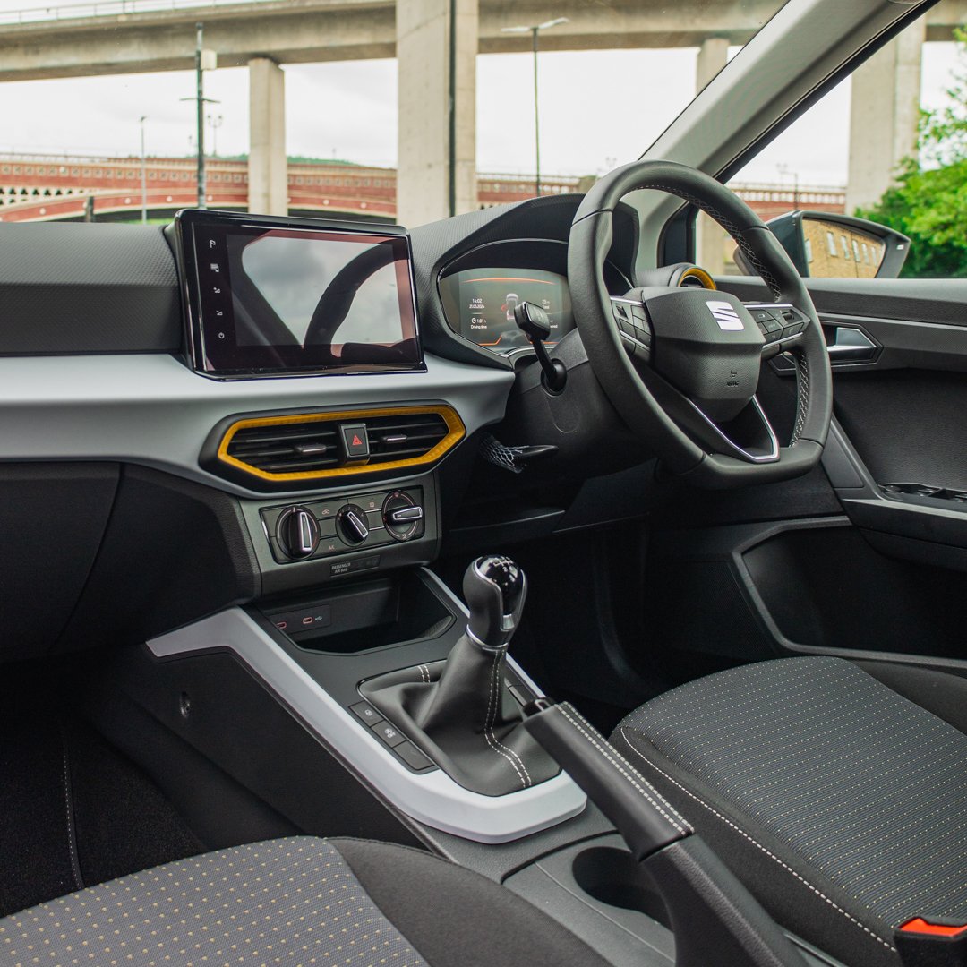 Interior of the SEAT Arona showcasing the digital cockpit and modern tech features, available with AMT Auto car leasing.
