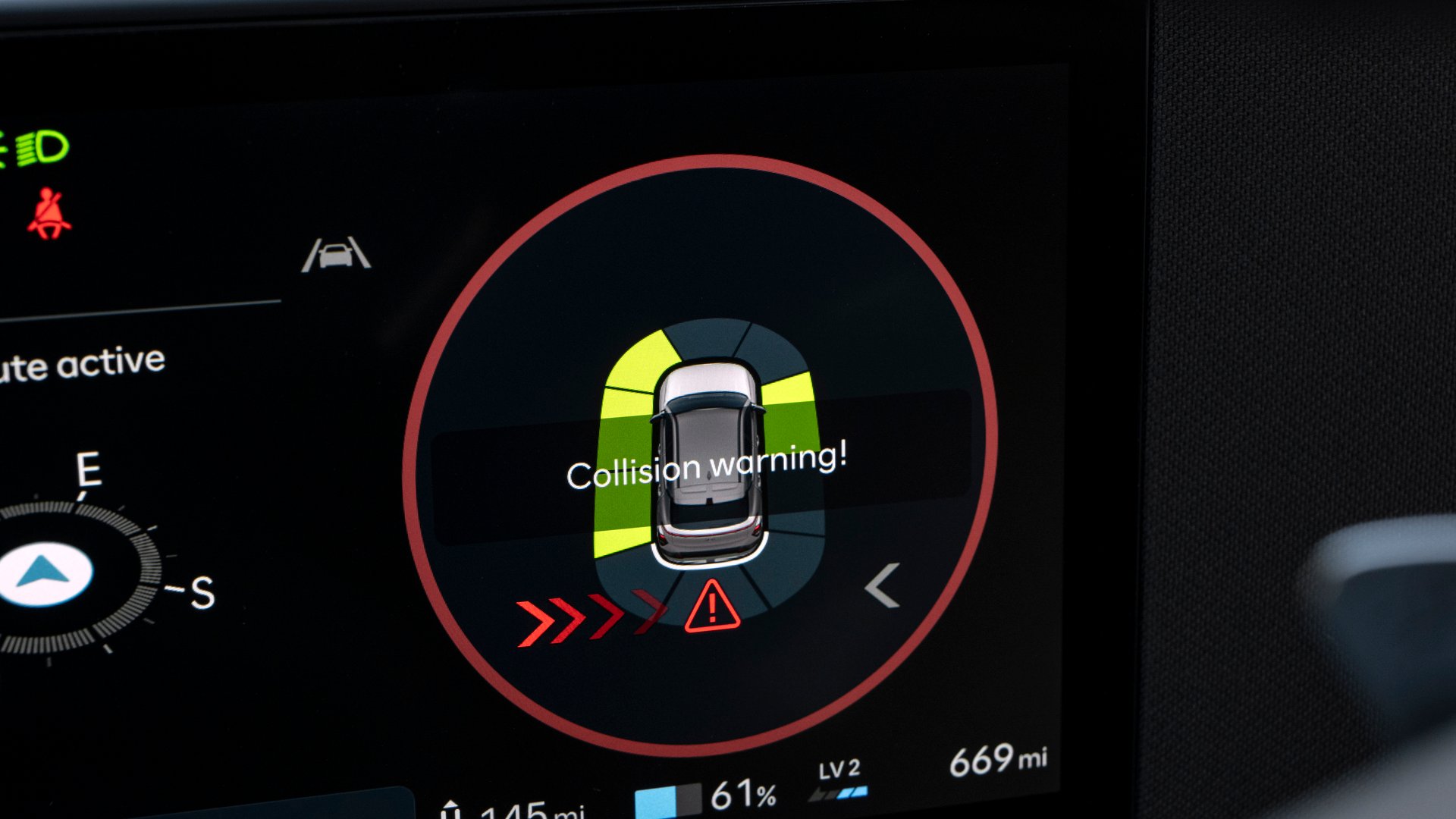 Hyundai Kona Electric’s collision avoidance assist system displayed on the digital screen, providing real-time safety alerts to prevent potential accidents