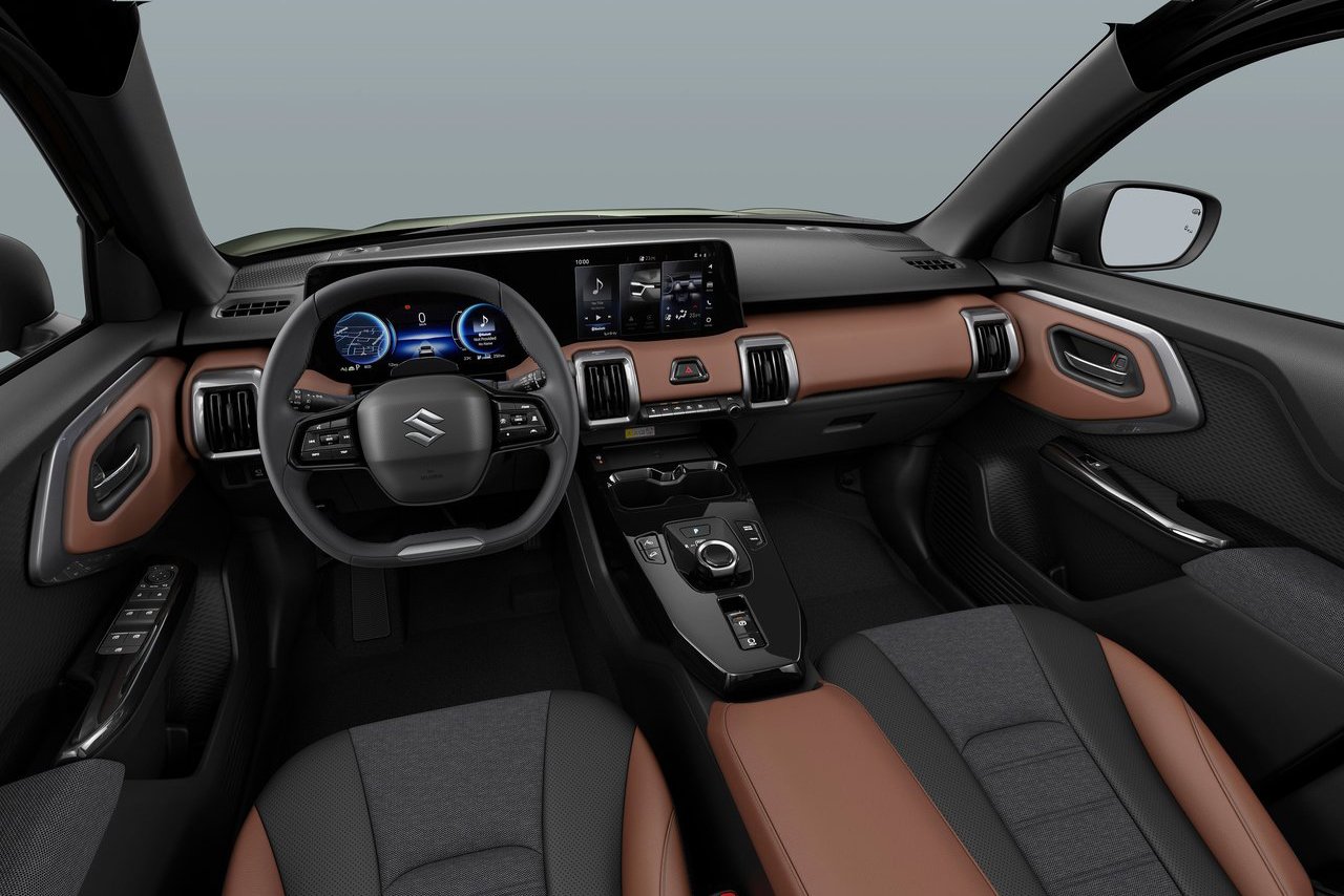 Interior of Suzuki E-Vitara electric SUV, showing dashboard and seating