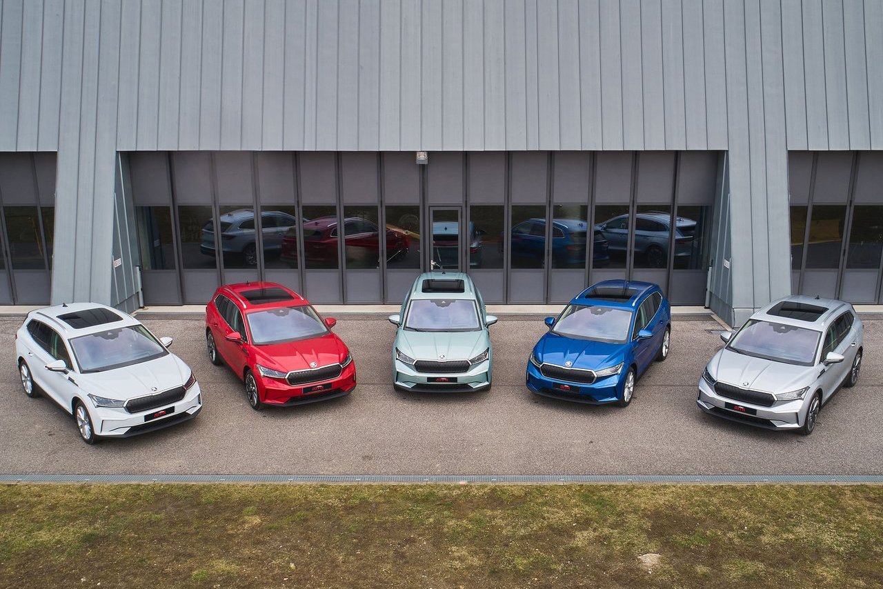 A line-up of Skoda Enyaq electric SUVs in various colours, representing diverse options for buyers and impressive electric range.