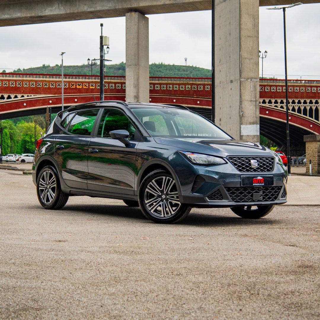 Front view of SEAT Arona FR parked in an urban setting, available through AMT Auto car leasing.
