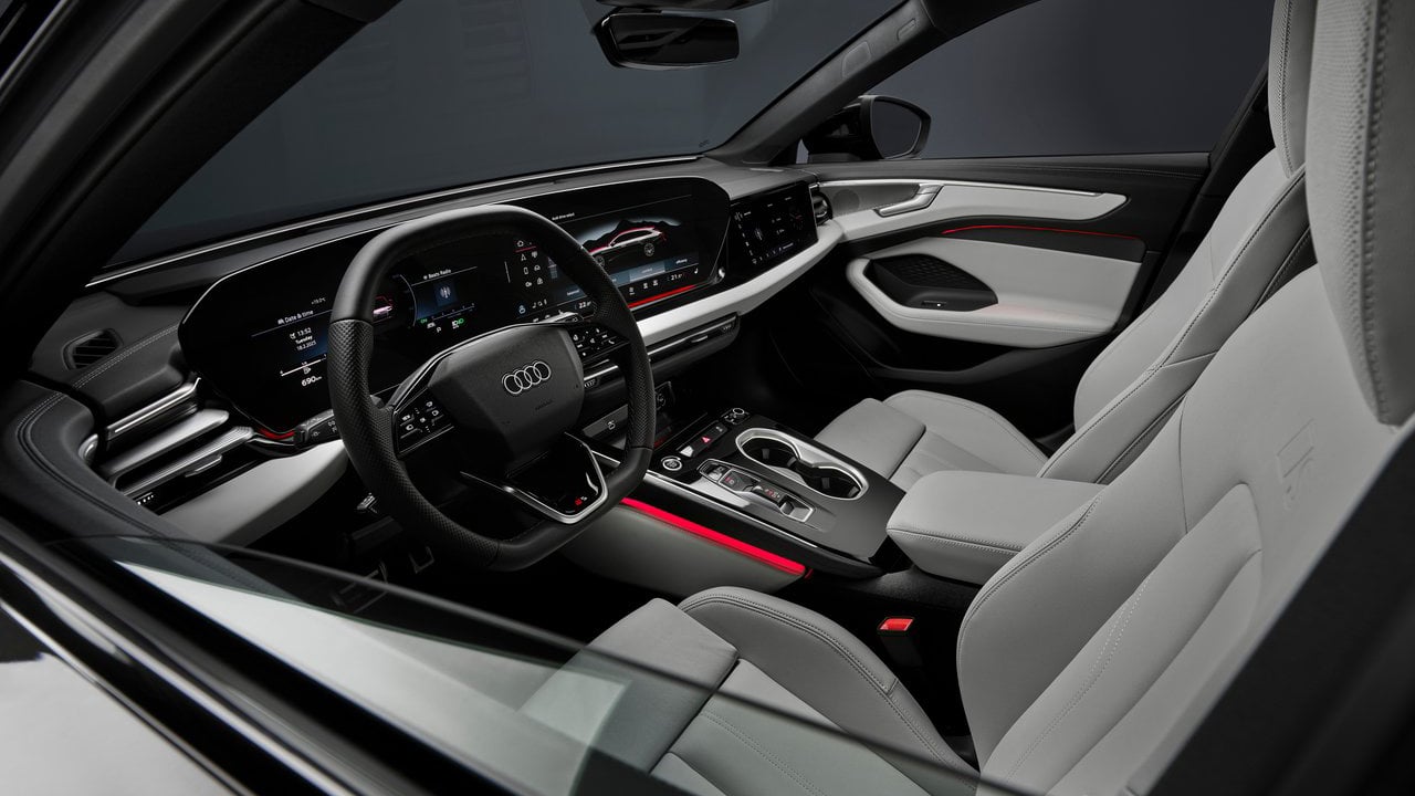 The driver-focused cockpit of the Audi A6 Avant, featuring a digital instrument cluster and ergonomic controls for a safe and comfortable driving experience.