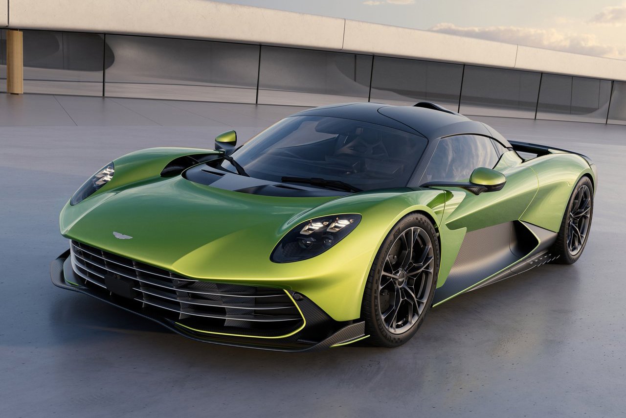 A futuristic Aston Martin Valhalla in vibrant green, parked on a sleek modern surface, symbolising cutting-edge design and engineering for 2025.