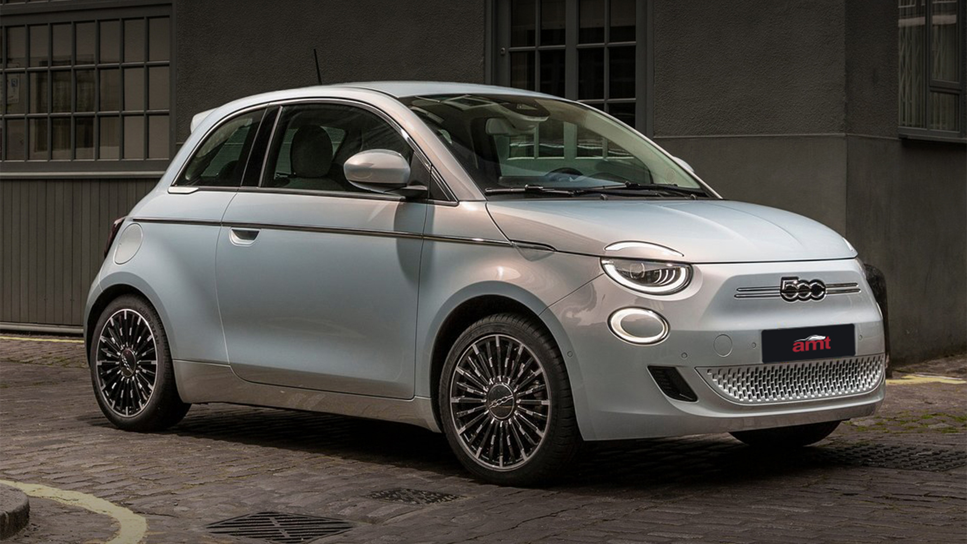 A 2024 Silver Fiat 500e in the city