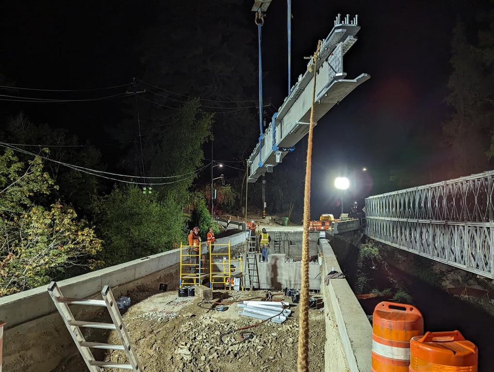 Night construction showing temporary bridge installation