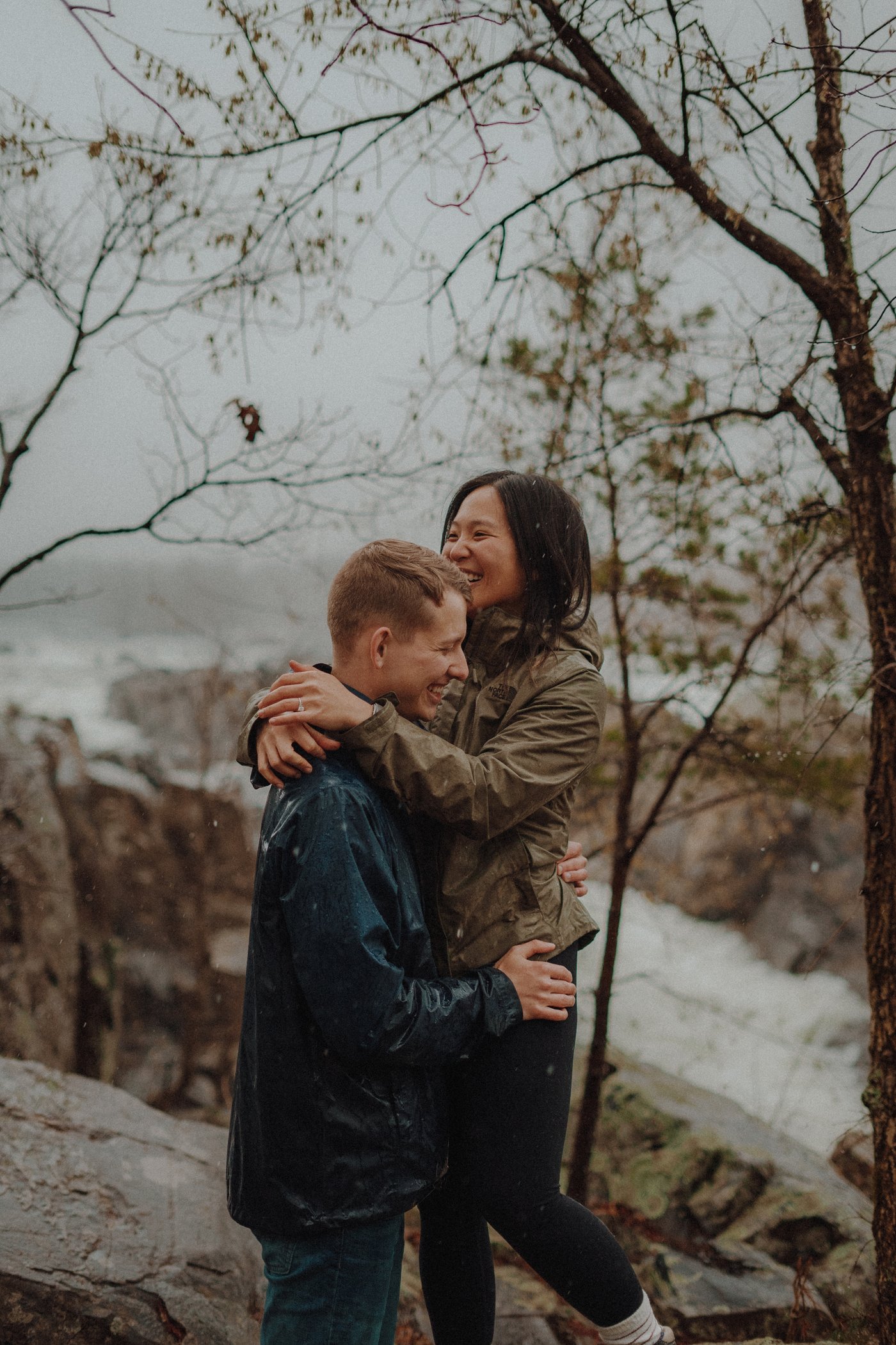 On the rocks above the river, the two of them wrapped up in each other's coats and laughing