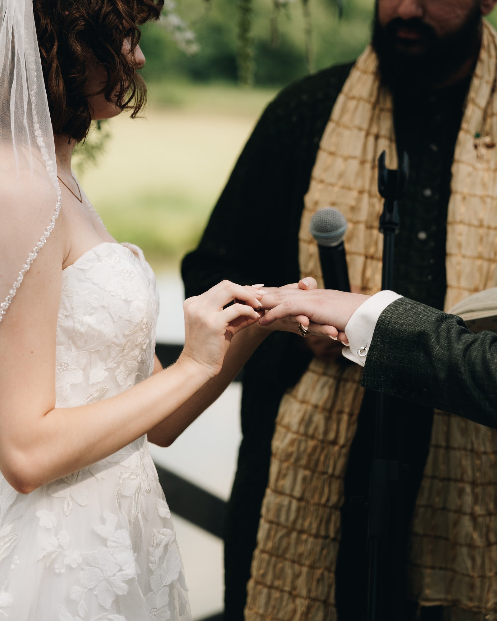 The bride and groom exchanging rings during the ceremony