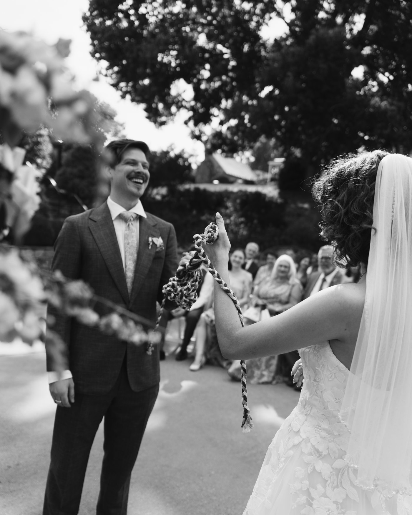Black and white, the couple coming back up the aisle into the crowd