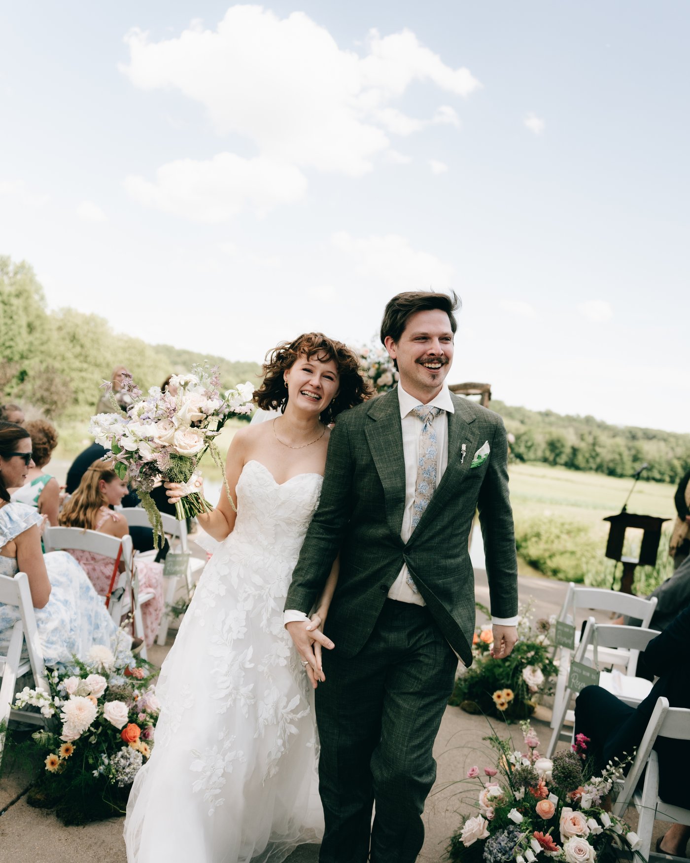 The bride and groom walking back down the aisle together