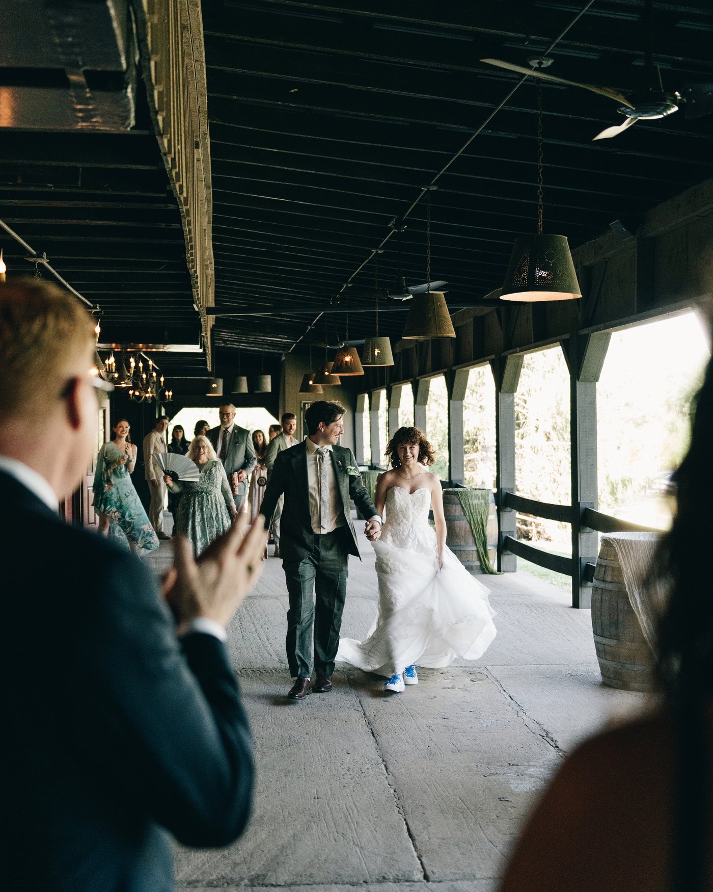 Guests gathered along the barn's long covered passage