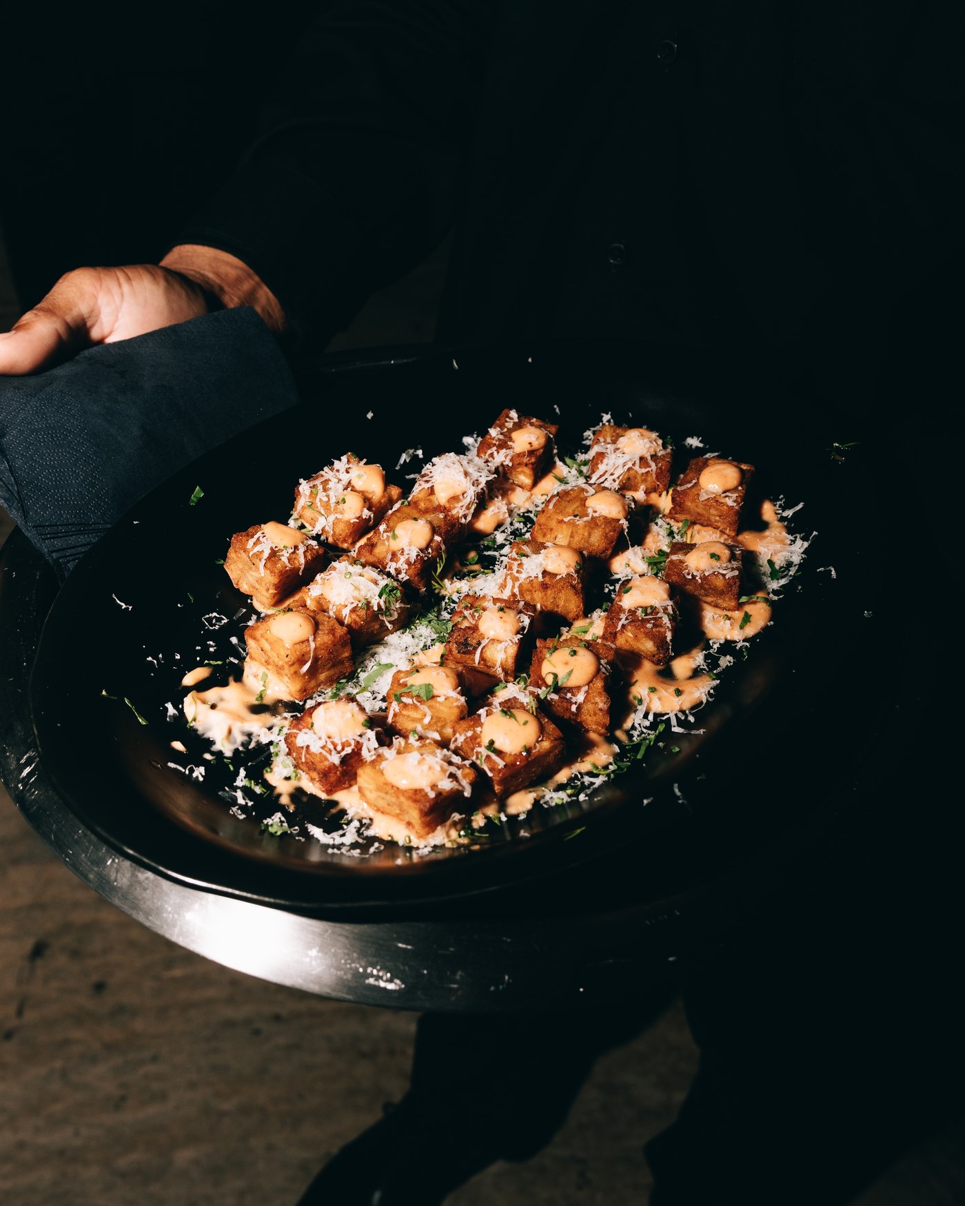 A tray of hot appetisers coming out of the kitchen
