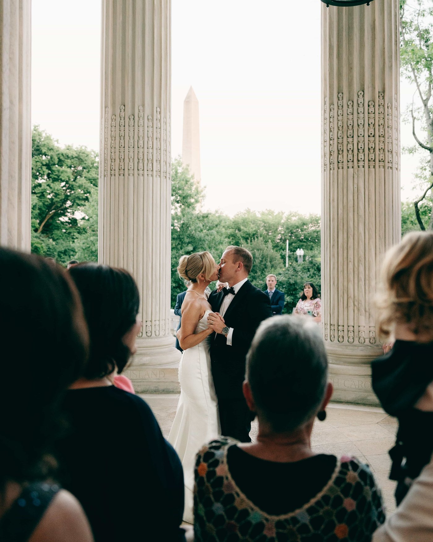 The two of them slow dancing between the columns at dusk, the Monument framed exactly in the middle