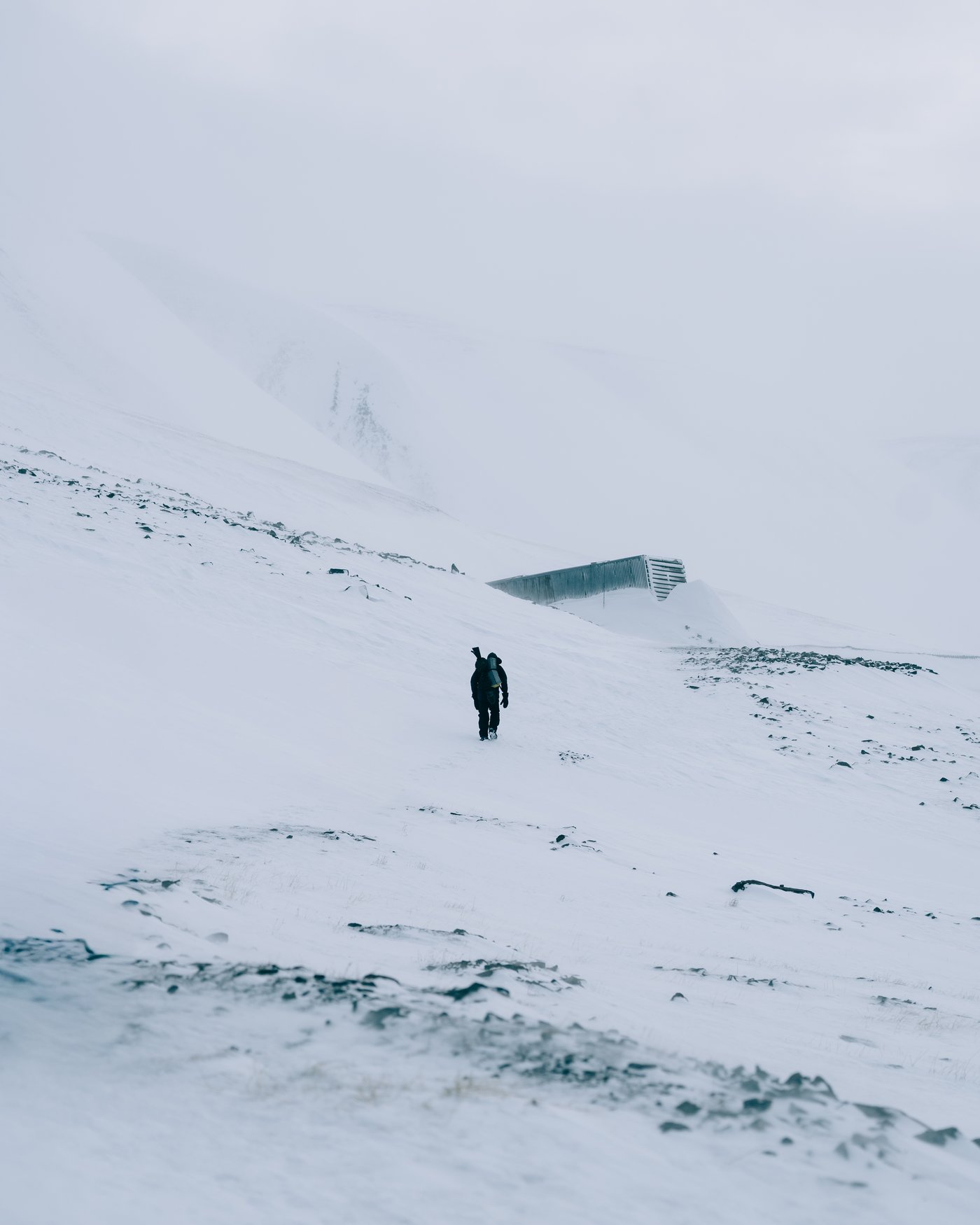 Anoop, our guide and my friend's partner, up to one of Longyearbyen's old mine portals.
