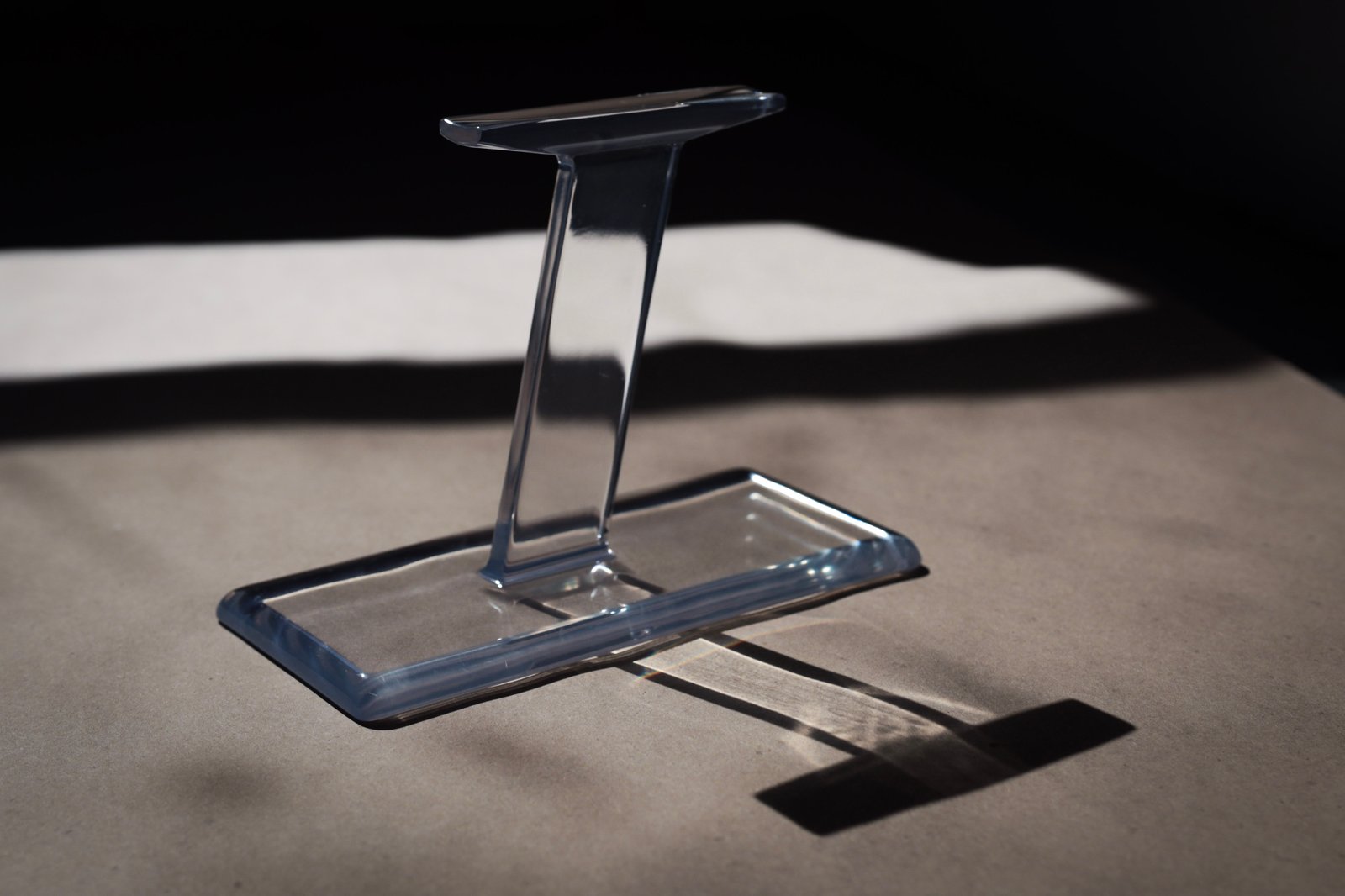 Optical clear PMMA printed on industrial SLA. Light passes through the part rather than scattering off the surface.