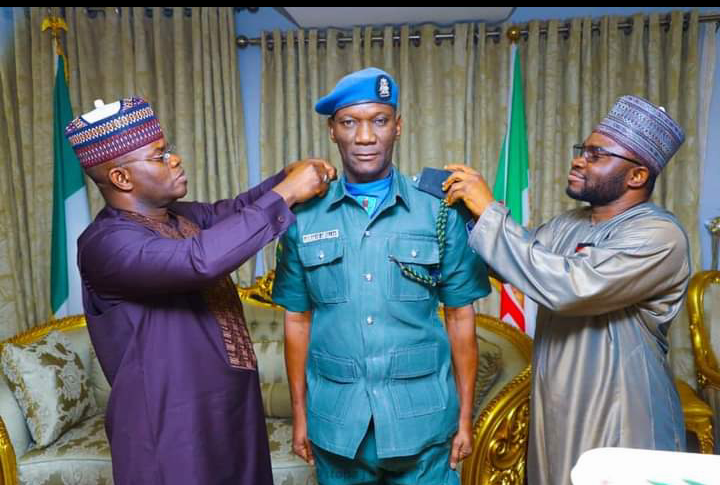 Governor Yahaya Bello Decorates Escort Commander, Abdullahi