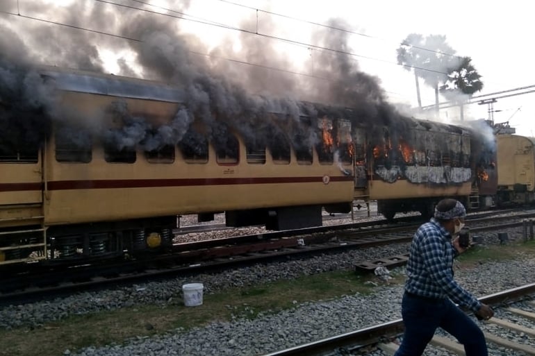 Protesters Burn Train Carriages Over Railway Jobs In India