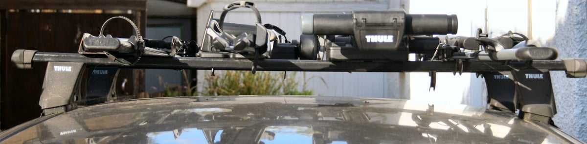 Front view of four bikes mounted on car roof using Thule racks