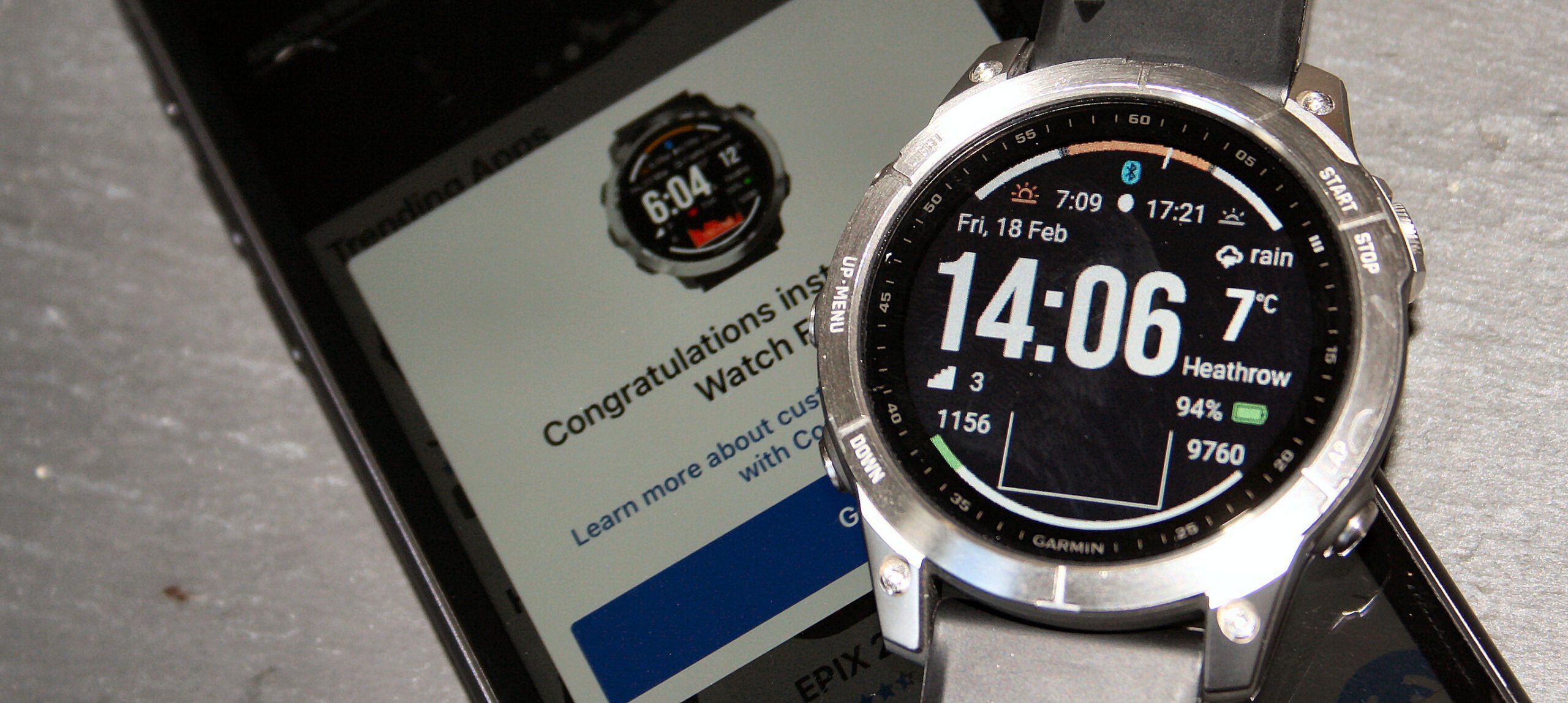 Garmin Fenix 7 with custom Connect IQ watch face — Garmin's volume-driven price strategy keeps flagship watches accessible