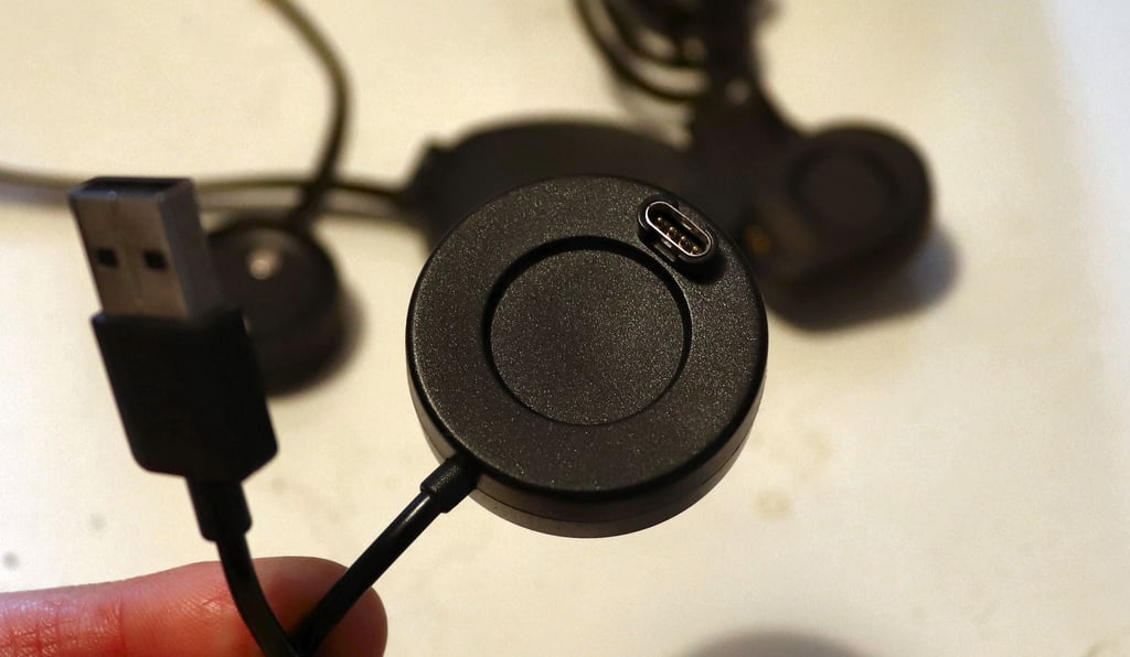 Garmin charging puck connected to USB power source