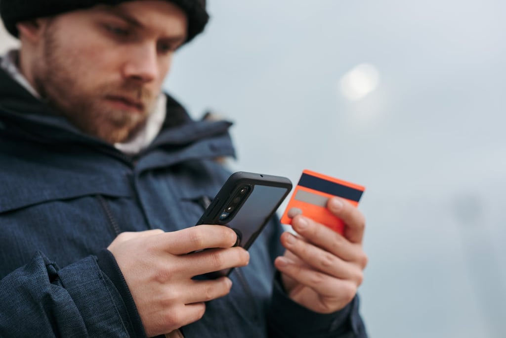 Photo by Anete Lusina: https://www.pexels.com/photo/serious-man-paying-online-purchases-using-smartphone-on-street-6353683/