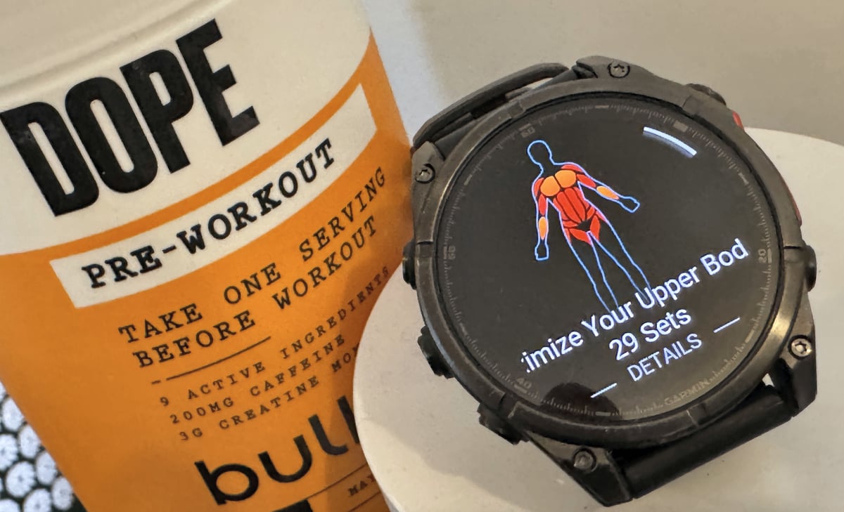 Garmin Fenix 8 strength coach screen showing workout tracking and set logging