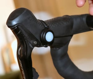 Ravemen PR1400 remote control attached to hoods