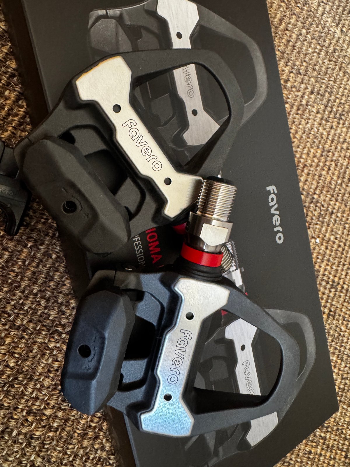 Favero Assioma Pro RS pedals close-up showing power meter sensor and SPD-SL cleat compatibility