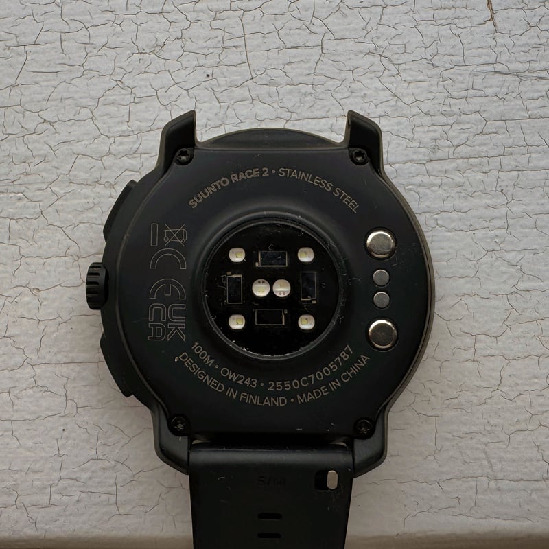 Suunto Race 2 rear view showing optical HR sensor and charging points