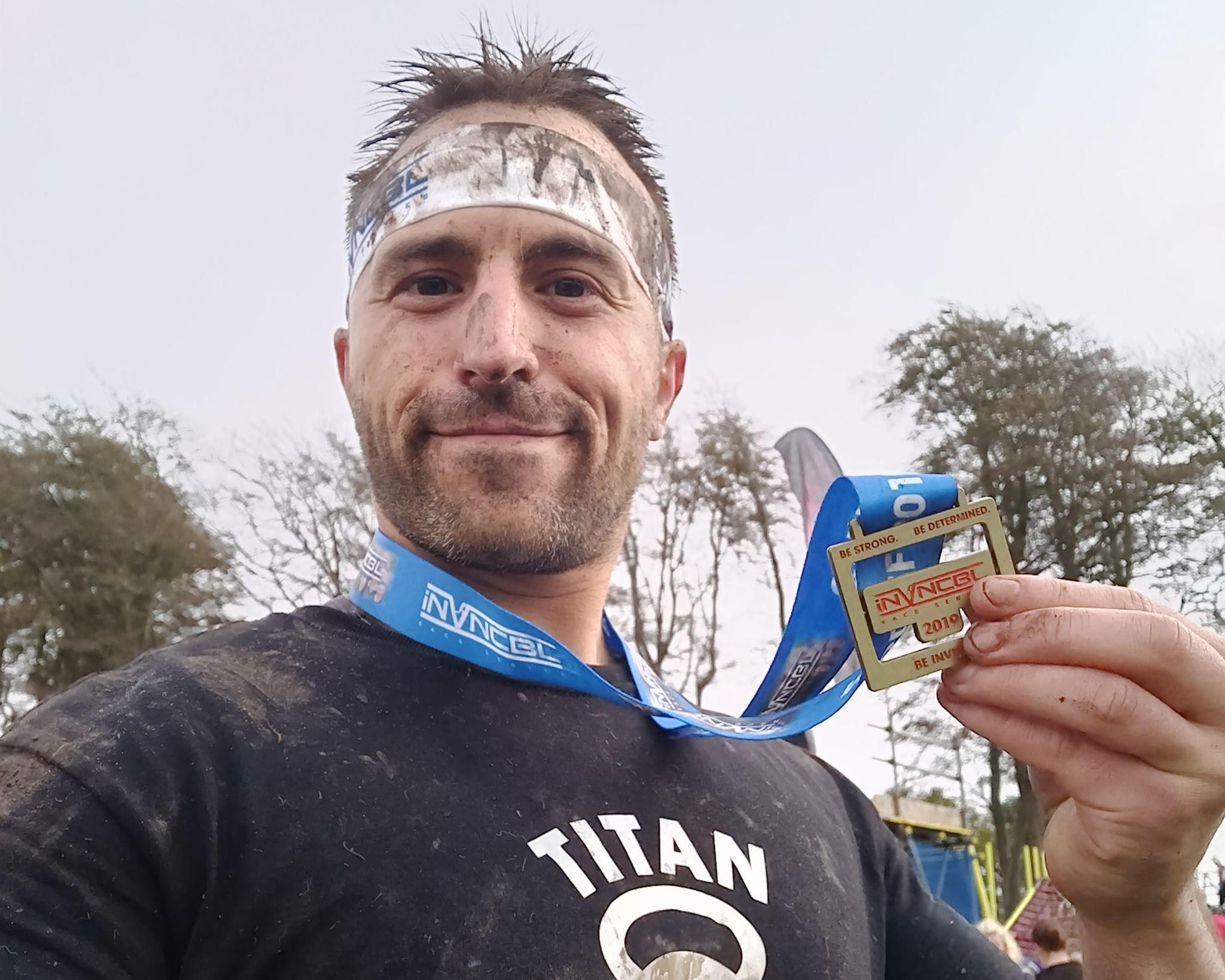 Chris holding his medal after coming second in the INVNCBL race in Cardiff