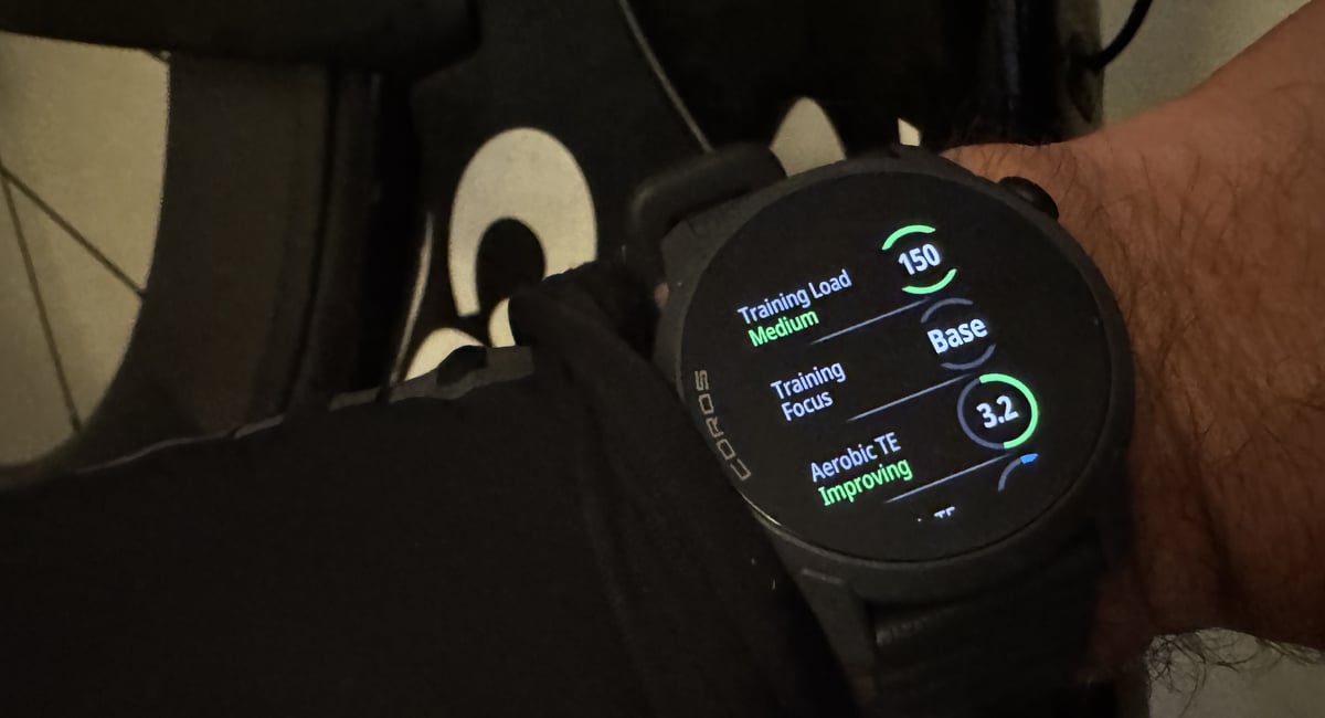 Athlete checking Training Load and Aerobic Training Effort on COROS Pace 4 after a ride