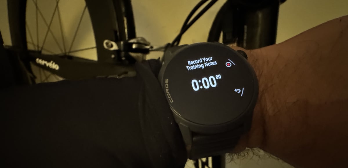 Cyclist recording a voice note after a workout using the COROS Pace 4