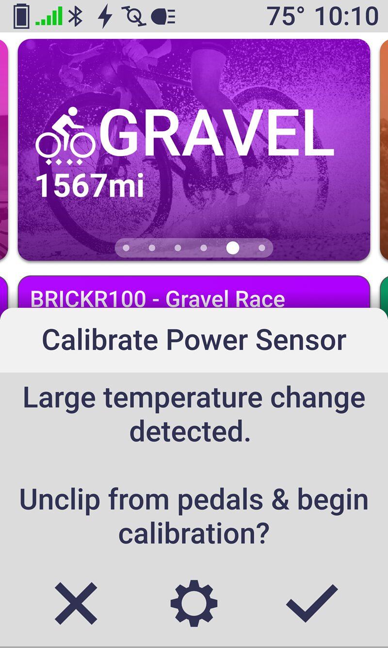 Garmin Edge bike computer screen showing Pedal IQ manual recalibration prompt for Rally pedals.