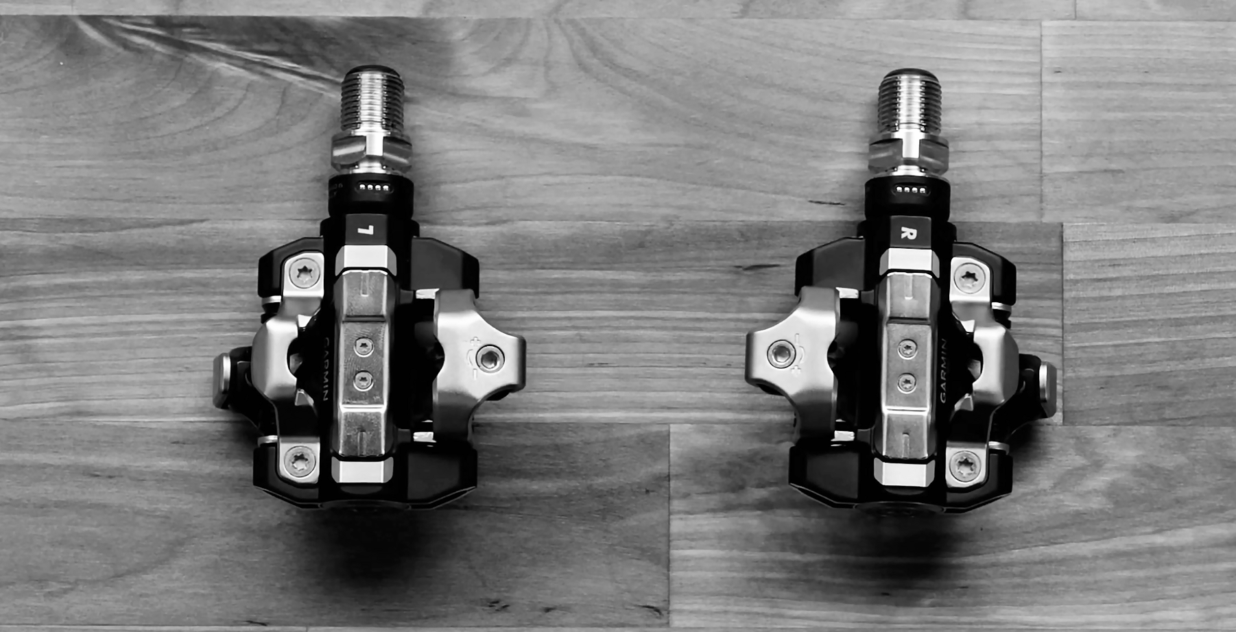 Garmin Rally XC210 MTB Trail pedals shwoing four charging pins and shimano SPD cleat mechanism