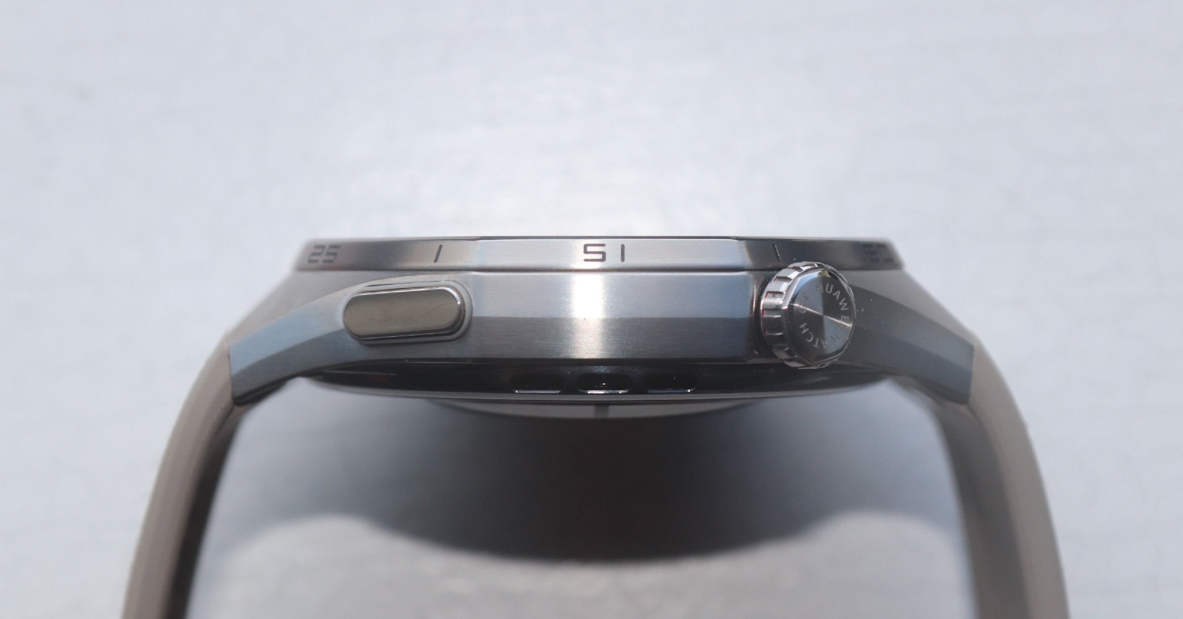 Huawei Watch GT 6 Pro side profile showing rotating crown physical buttons and octagonal bezel design