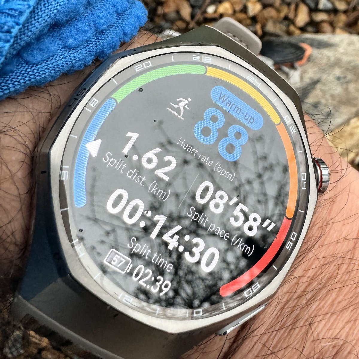 Huawei Watch GT 6 Pro stopped during a run , running shoe and stryd footpod in background demostrating I used the watch for sport