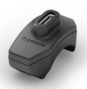 Garmin Rally XC210 SPD mountain bike pedals showing four-pin charging interface and cleat mechanism.