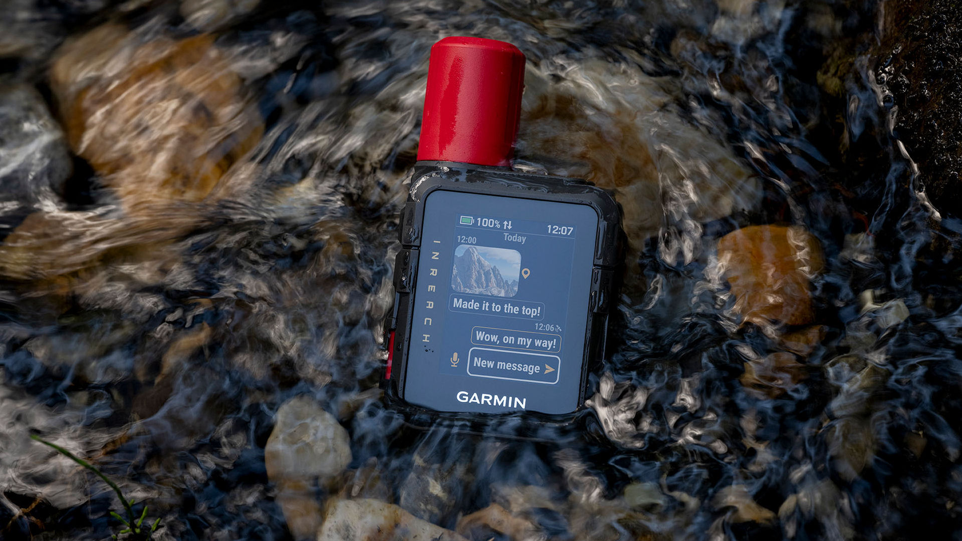 Garmin inReach Mini 3 Plus review satellite communicator immersed in a river, showing IP67 waterproofing and rugged durability.