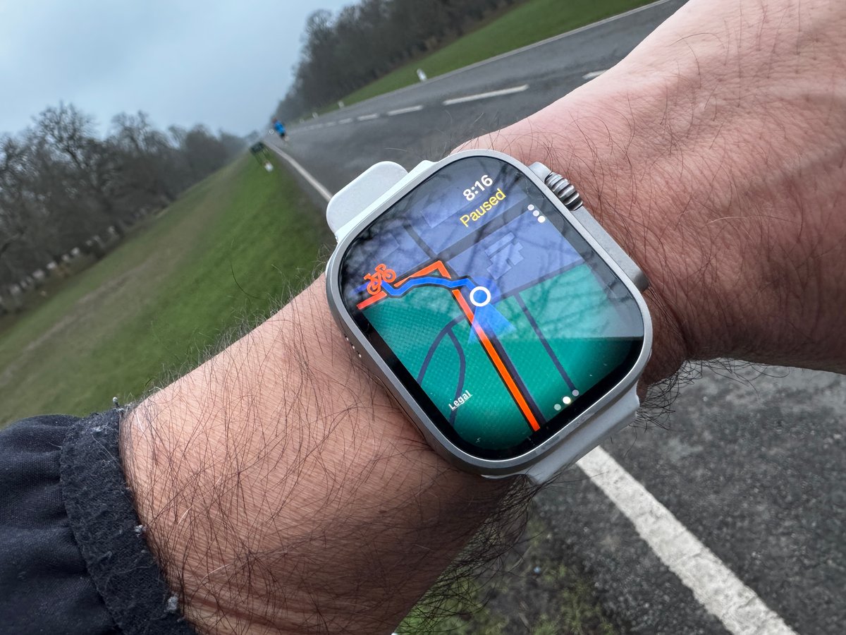 Runner wearing Apple Watch Ultra displaying Strava route navigation with map overlay and current position tracking