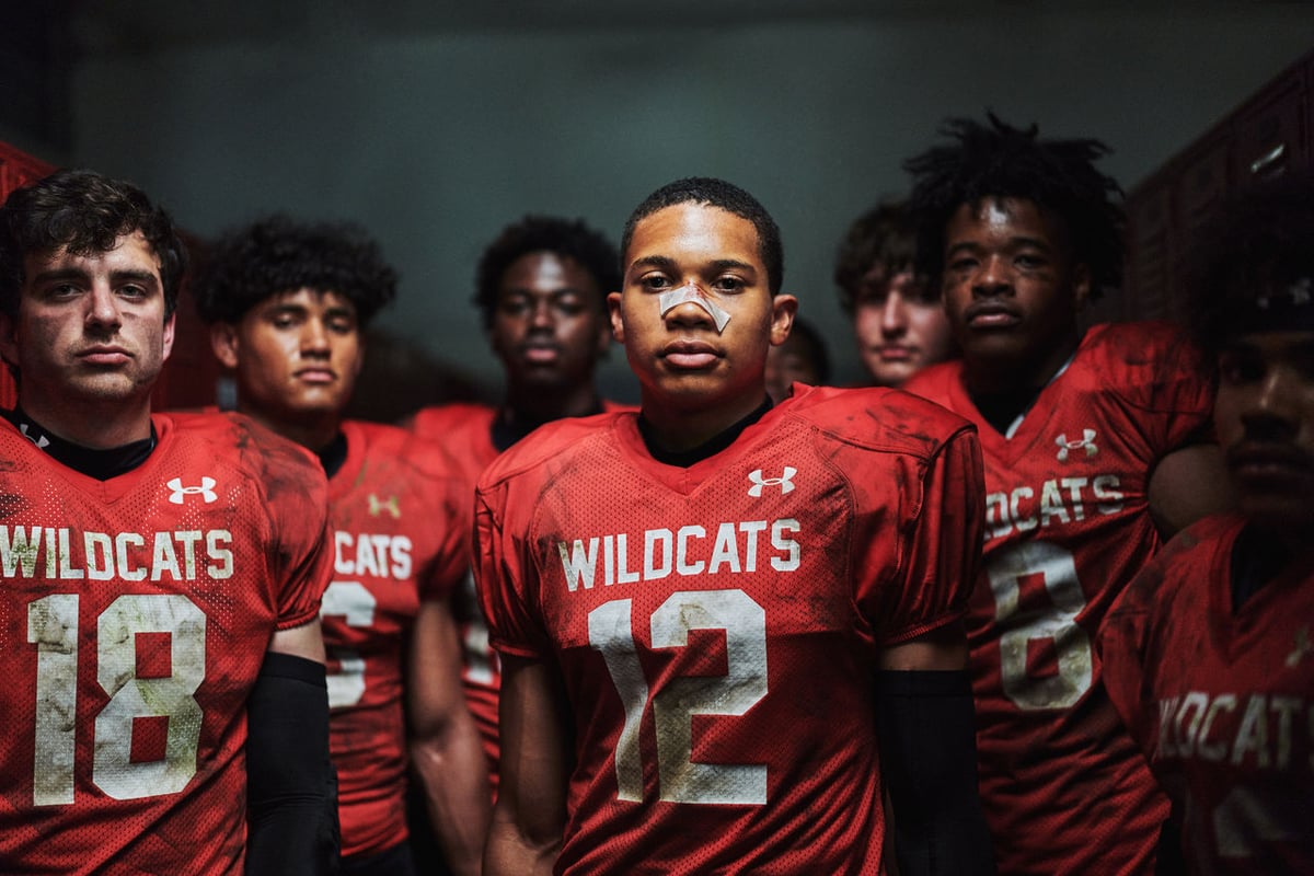 Under Armour American football players on field representing brand digital security and corporate trust