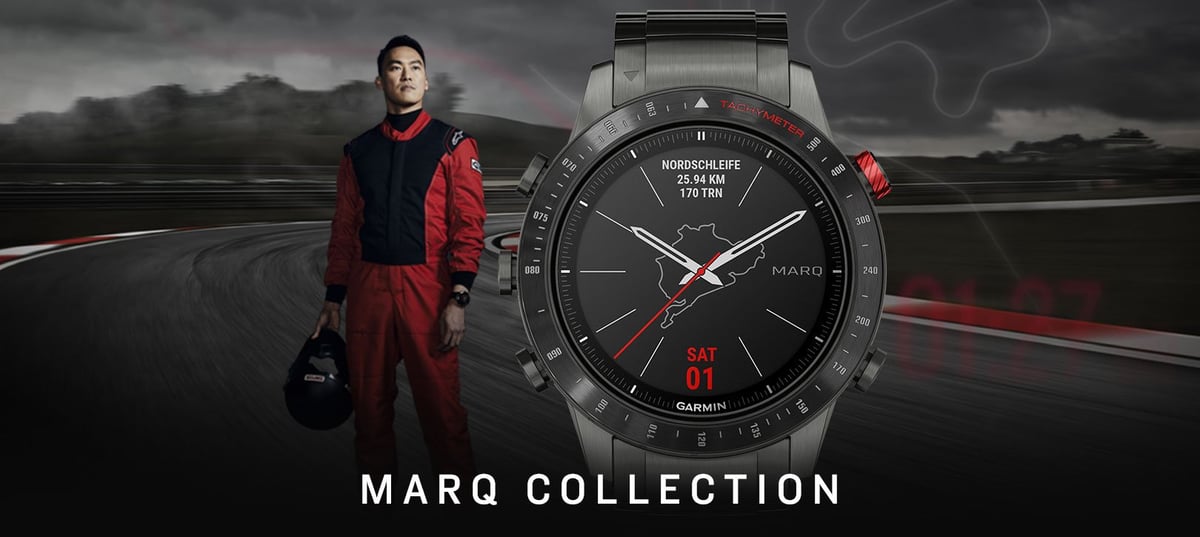 Garmin MARQ Driver watch on wrist beside motorsport racing driver on track — 25 Hz GNSS positioning