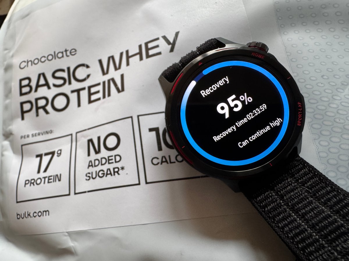 Huawei Watch GT Runner 2 showing recovery status screen alongside whey protein isolate