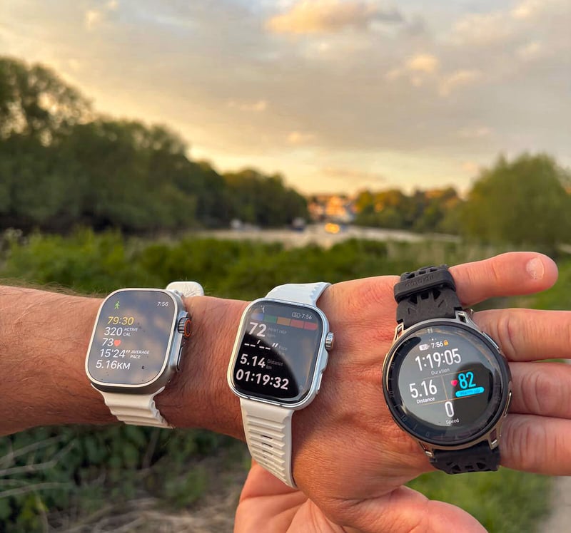 Huawei Watch Fit 5 Pro, Apple Watch Ultra 3 and Amazfit Cheetah 2 Pro worn together on riverside path during testing