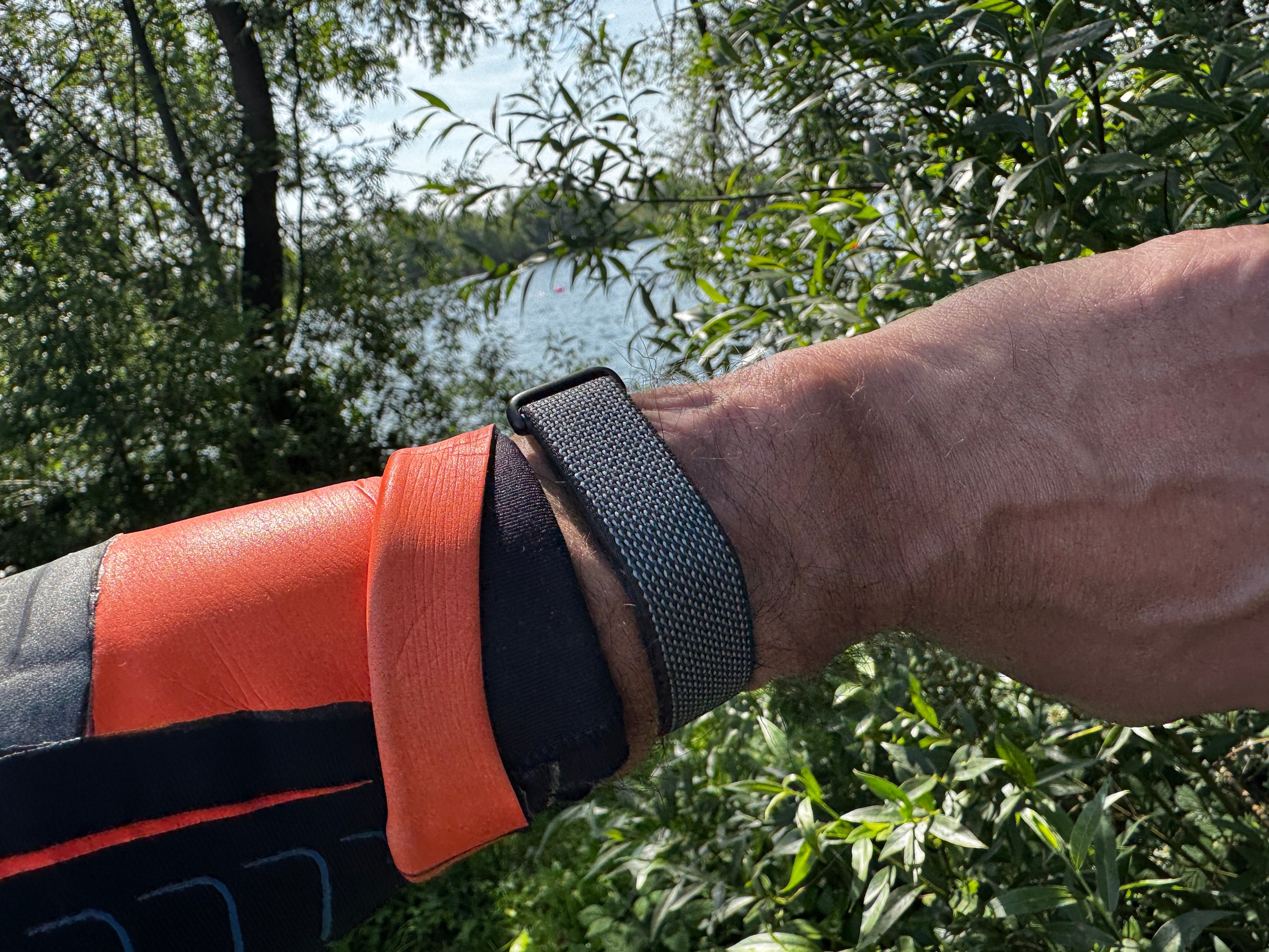Fitbit Air worn under wetsuit sleeve for open water swim HR test