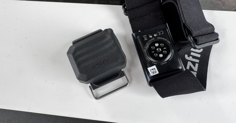 Amazfit Helio Core Motion HR arm strap and Helio Core Motion waist sensor held in hand at HYROX World Championship Stockholm