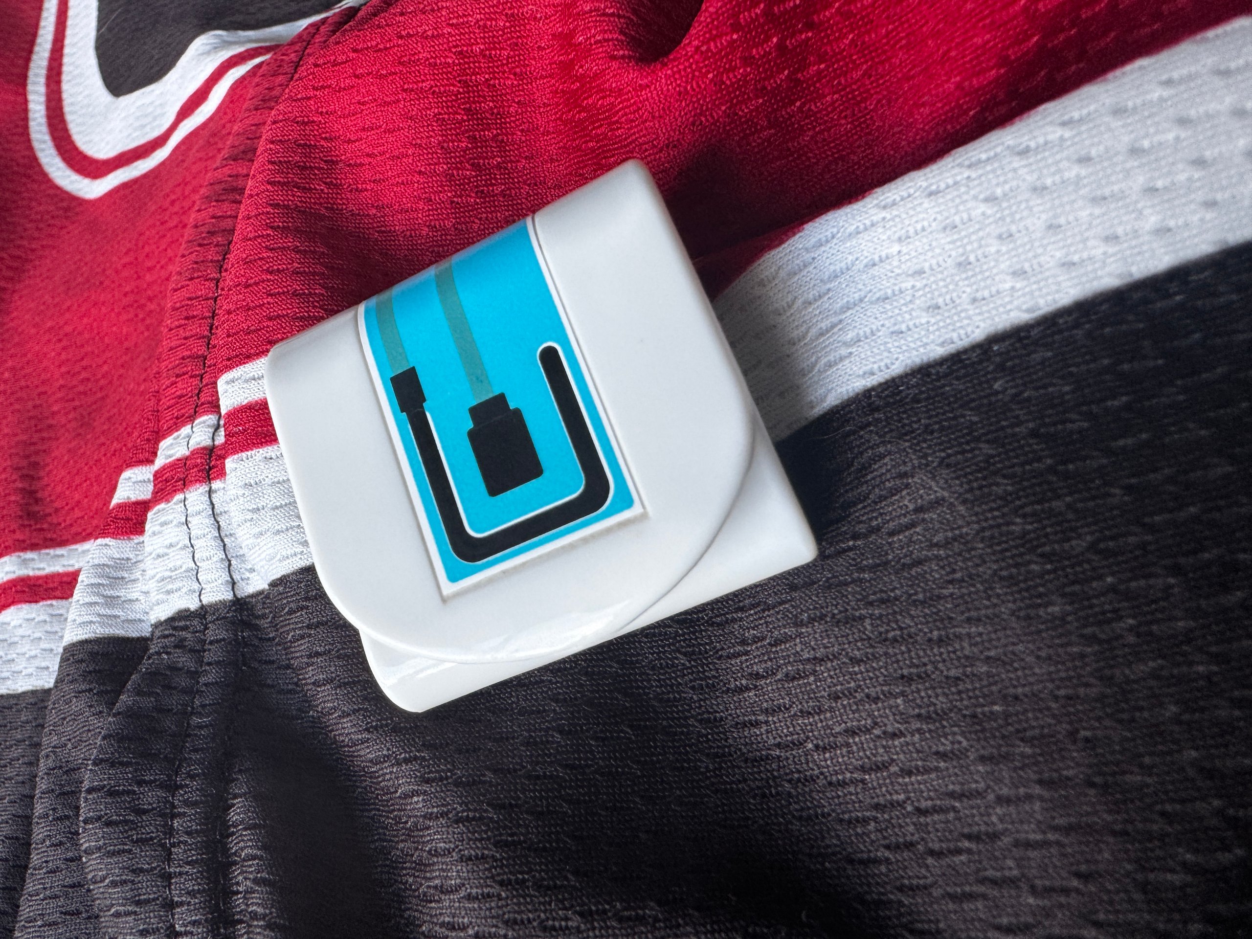 hDrop sweat and sodium sensor resting on a cycling jersey