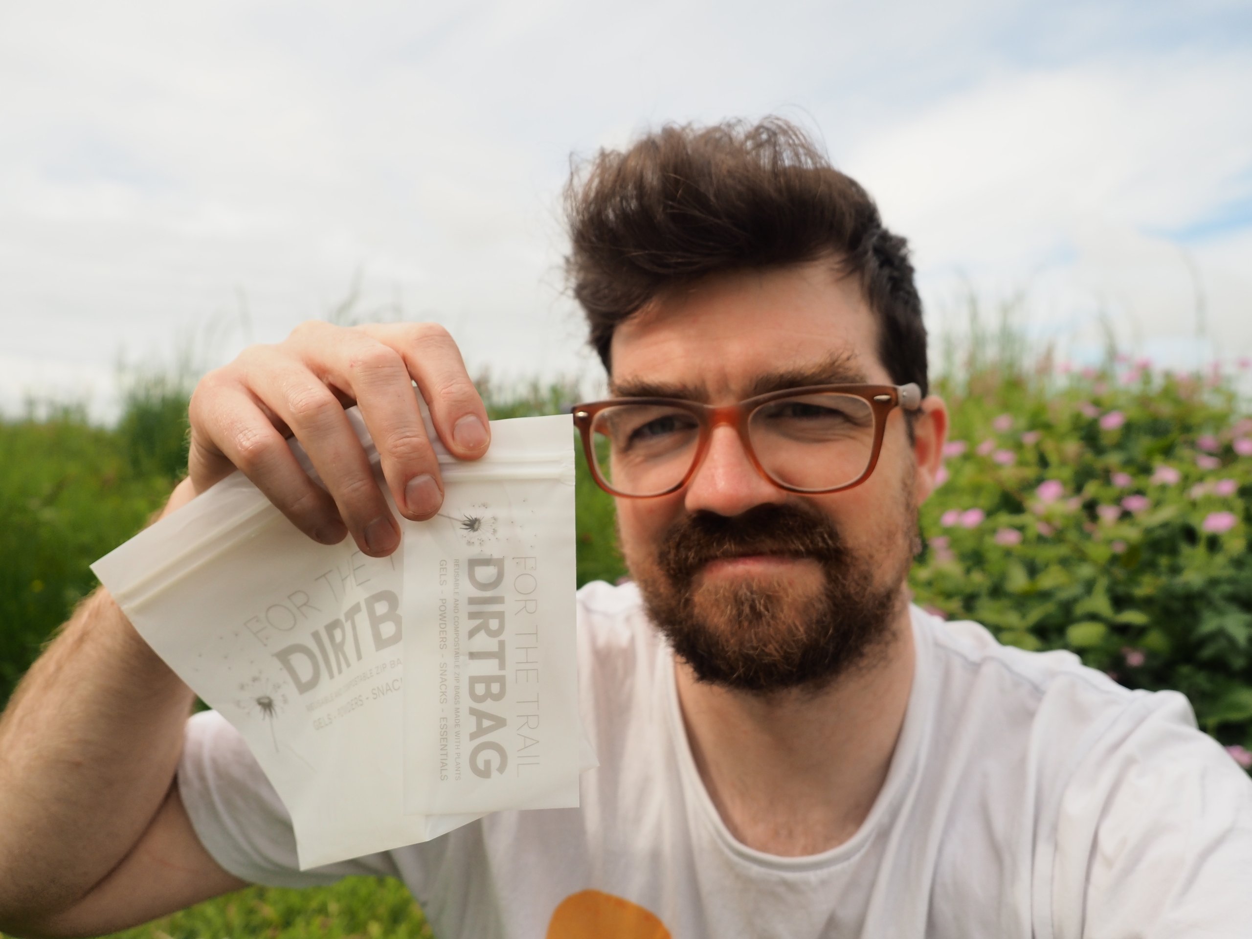 Martin, founder of For The Trail, holding Small and Large DirtBag reusable bioplastic fuel pouches from the first production batch