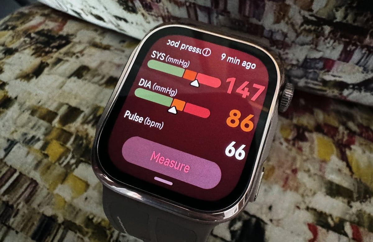 Huawei Watch D3 blood pressure watch showing a blood pressure reading on screen