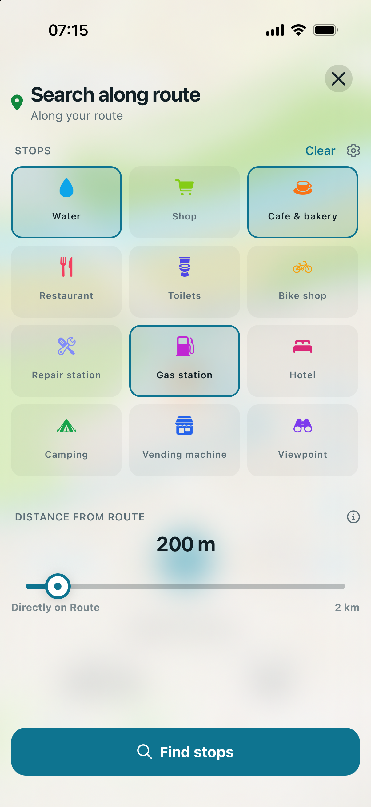 Route Companion stop search with water, cafe and bakery, and gas station selected and the distance-from-route slider set to 200 metres