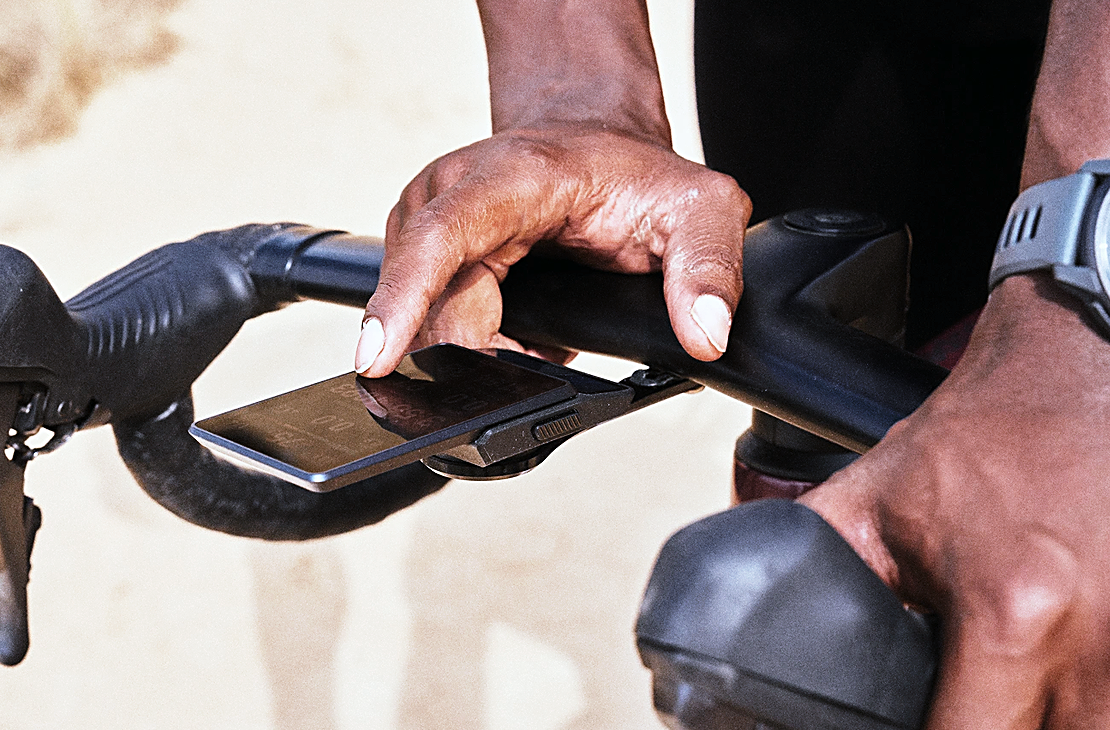 COROS Dura 2 Solar touchscreen in use on the handlebars, seen from the side